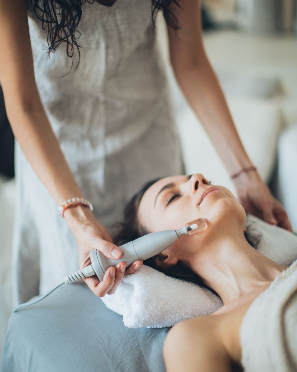 Woman receiving a professional facial treatment at a South Florida med spa